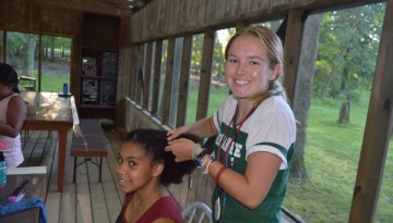 Campers braiding hair