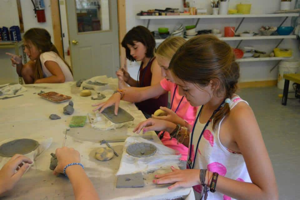 Campers playing with clay