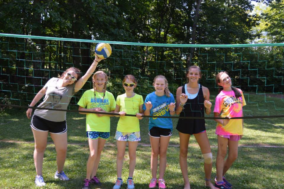 Campers playing volleyball