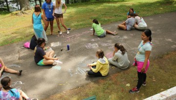 Campers playing with chalk
