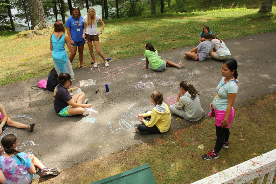 Campers playing with chalk