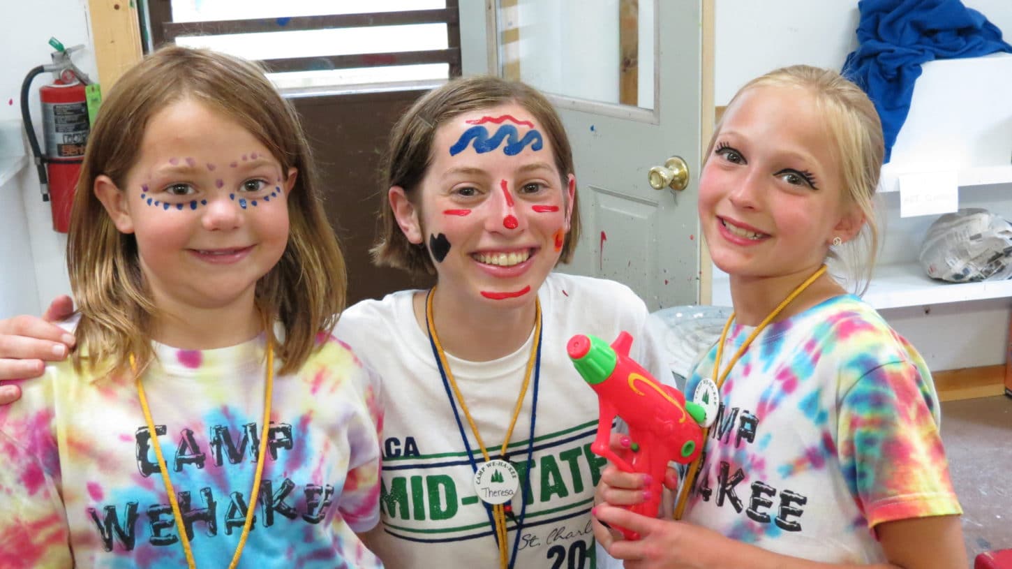 Campers and staff with face paints at WeHaKee Camp for Girls.