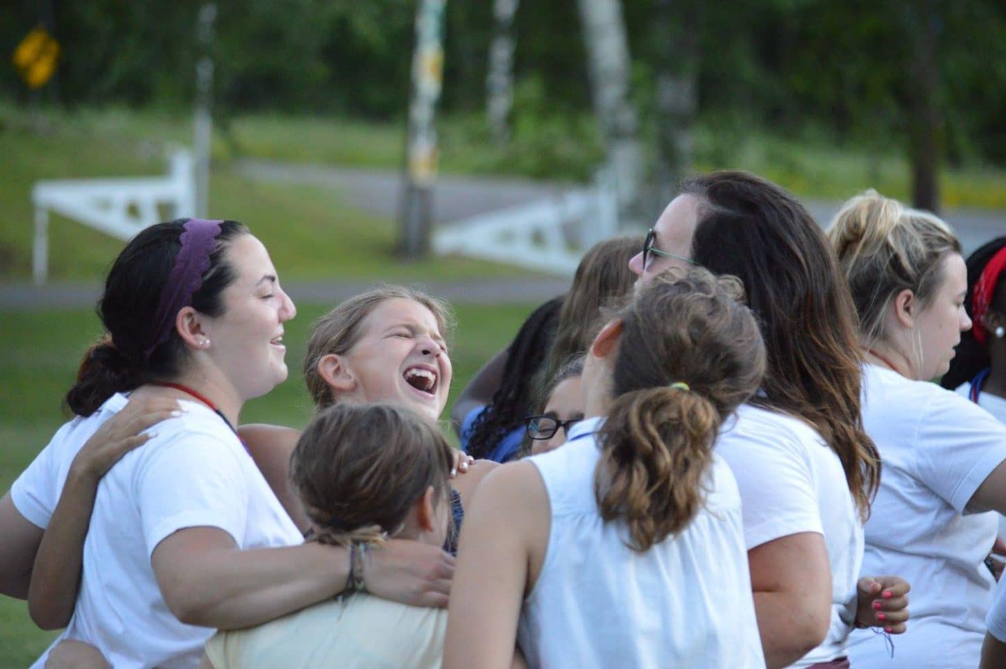 Staff and campers at WeHaKee Camp for Girls giving a big group hug.