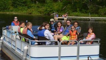 WeHaKee Camp for Girls campers on a pontoon boat.