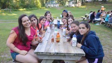 WeHaKee Camp for Girls campers enjoying popsicles.
