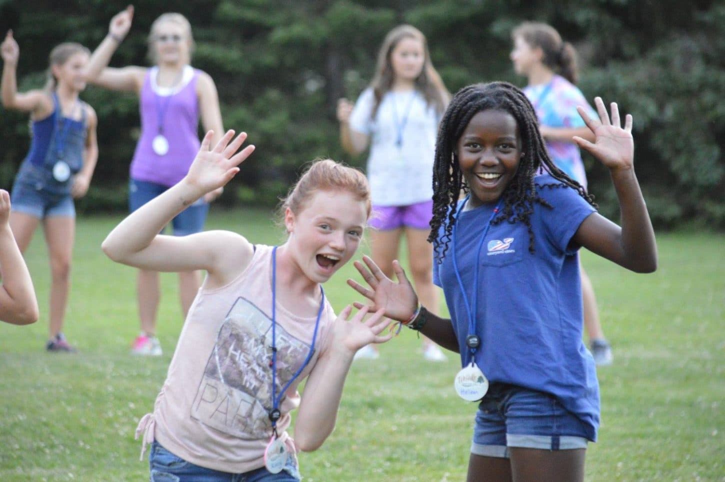 Campers waving at WeHaKee Camp for Girls.