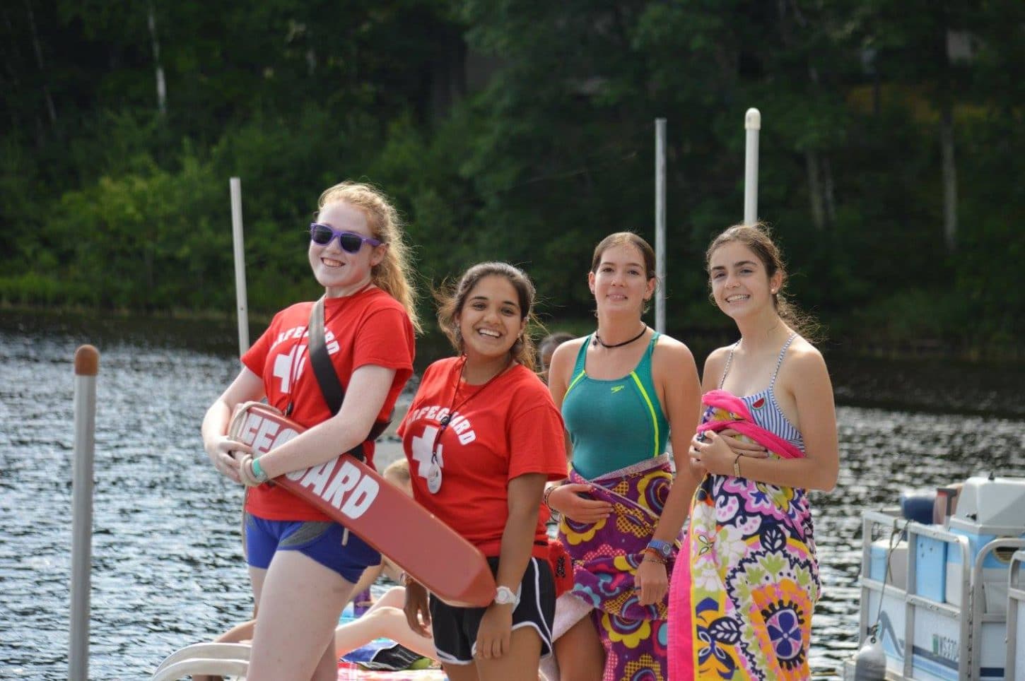 WeHaKee Camp for Girls lifeguards and campers on the dock.