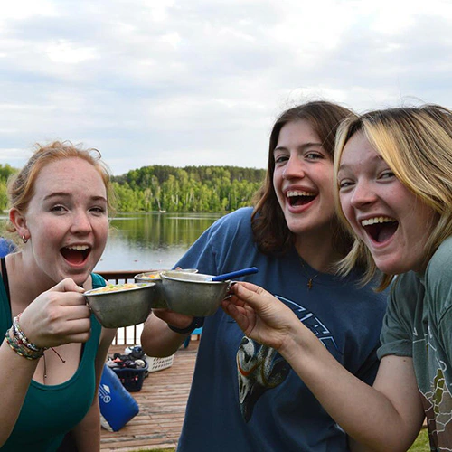 wehakee-camp-for-girls-lunch-outdoors-staff-members-bonding-2024-winter-wisconsin