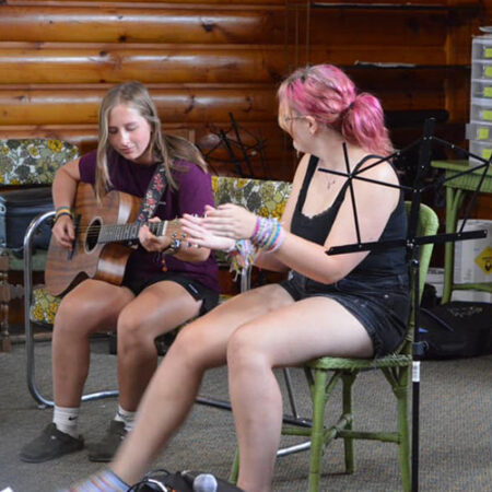 wehakee-camp-for-girls-music-guitar-playing-practice-campers-focus-activity