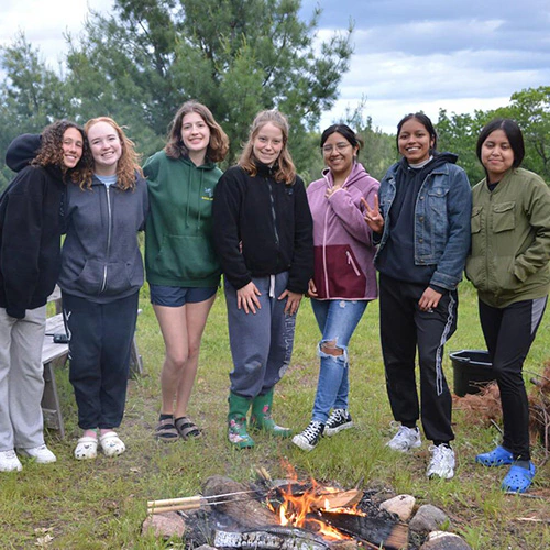 wehakee-camp-for-girls-staff-campfire-bonding-2024-winter-wisconsin