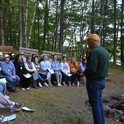 wehakee-camp-for-girls-staff-meeting-coucil-fire-director-bob-2024-winter-wisconsin